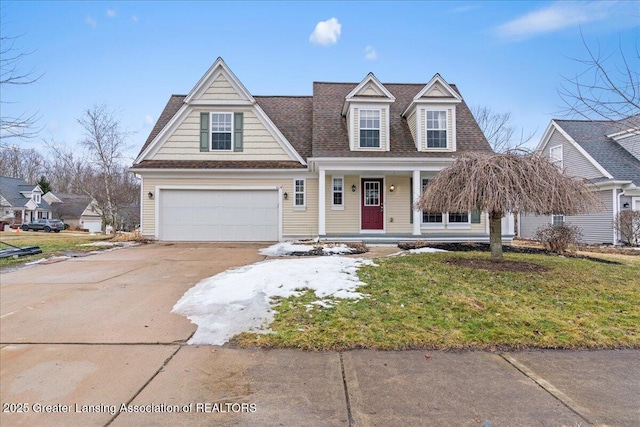 view of front of property with driveway, covered porch, a front lawn, and roof with shingles