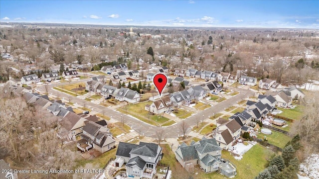 birds eye view of property with a residential view