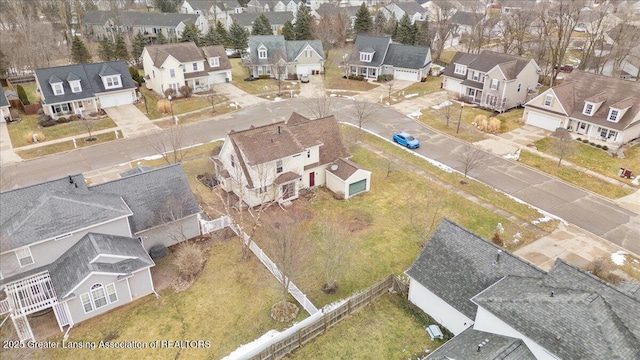 birds eye view of property with a residential view