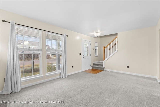 interior space featuring stairs, carpet, and baseboards