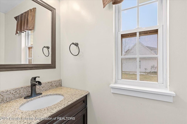 bathroom with a wealth of natural light and vanity