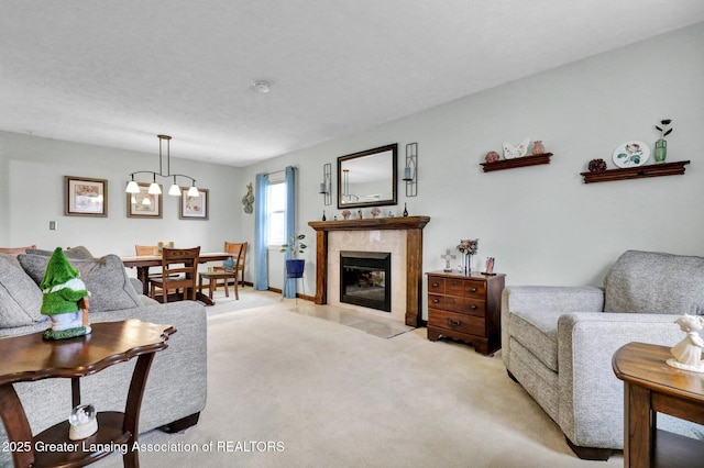 living room featuring a fireplace with flush hearth and light colored carpet