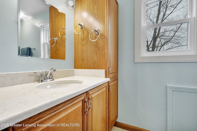 bathroom featuring vanity and baseboards