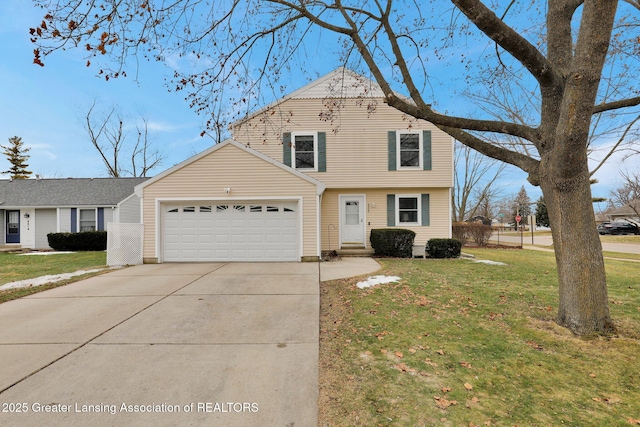 view of front of property with a garage, driveway, and a front yard