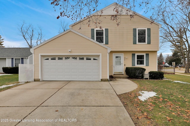 view of front of home with a garage, driveway, and a front lawn