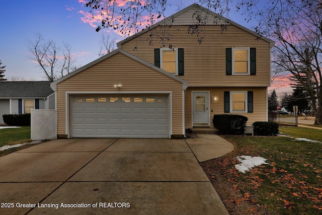 view of front facade with driveway and an attached garage