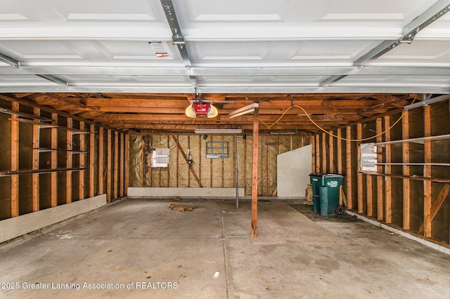 garage featuring a garage door opener