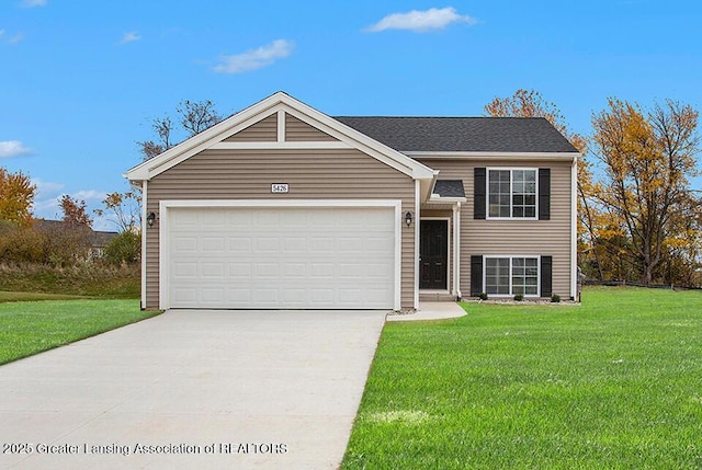 view of front facade featuring driveway, a front lawn, and an attached garage