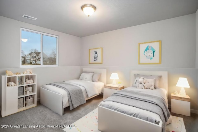 bedroom featuring visible vents and carpet flooring