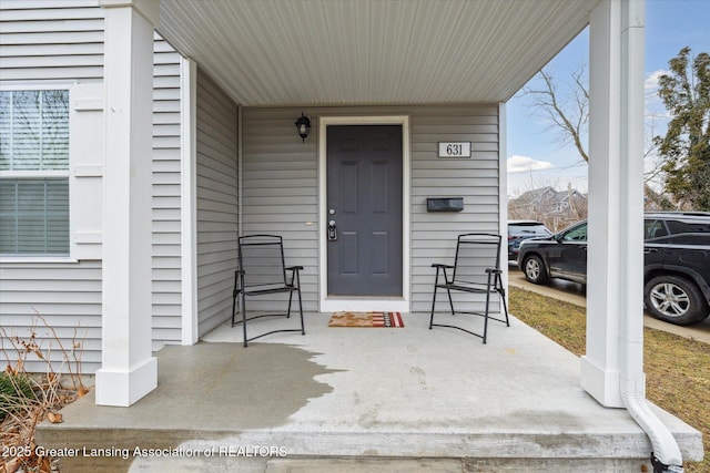 doorway to property featuring covered porch