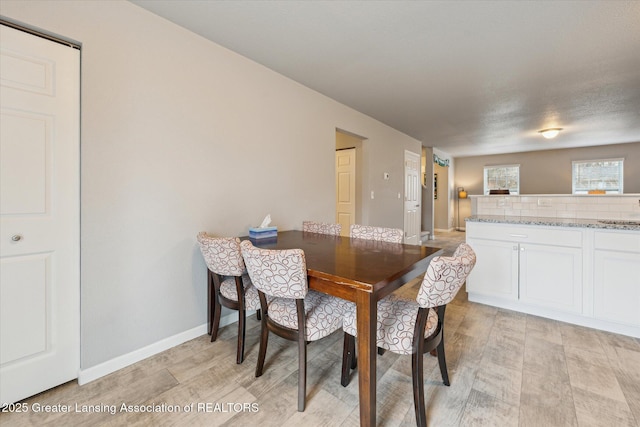 dining room featuring baseboards