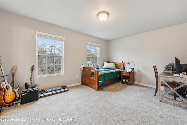 carpeted bedroom with baseboards