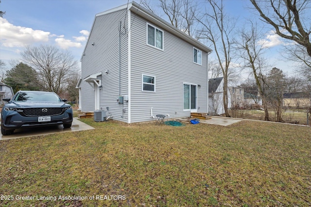 exterior space featuring entry steps, central AC, and a lawn