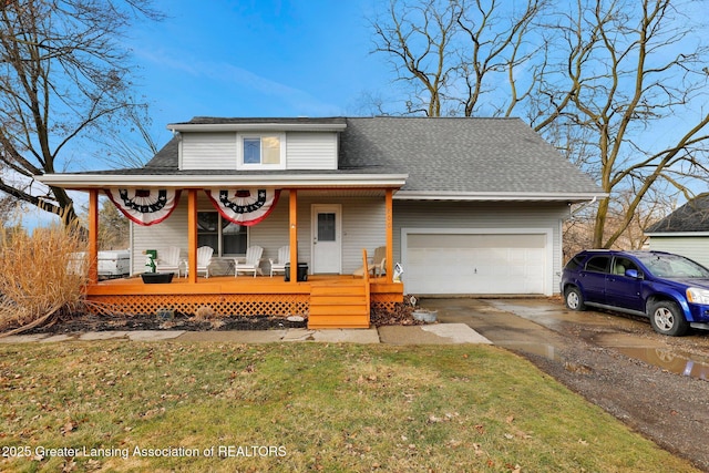 view of front of home featuring a garage, covered porch, roof with shingles, and driveway