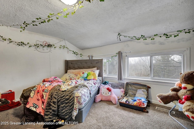 carpeted bedroom with vaulted ceiling and a textured ceiling