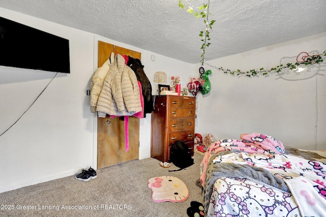 carpeted bedroom with a textured ceiling