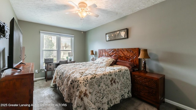 carpeted bedroom with ceiling fan, baseboards, and a textured ceiling