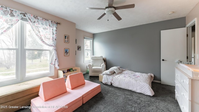 carpeted bedroom with a ceiling fan