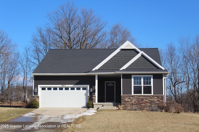 craftsman house with a garage, stone siding, concrete driveway, and a front yard