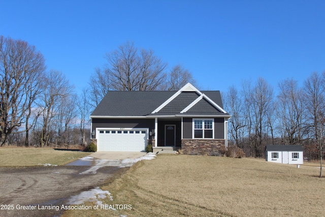 craftsman-style house featuring stone siding, concrete driveway, a front lawn, and a garage