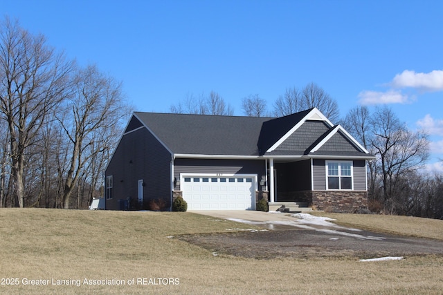 craftsman-style home with an attached garage, stone siding, a front lawn, and concrete driveway