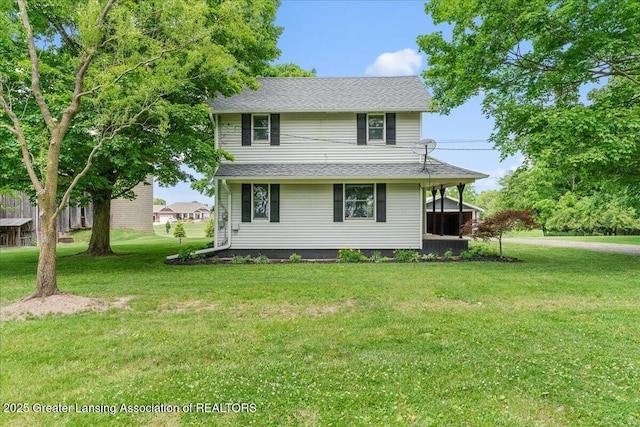 9840 W Herbison Rd, Eagle, MI 48822 - view of front of house featuring a front lawn and a shingled roof
