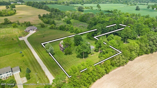9840 W Herbison Rd, Eagle, MI 48822 - aerial view of sparsely populated area with property boundaries highlighted and a tree filled landscape