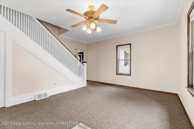 9840 W Herbison Rd, Eagle, MI 48822 - carpeted spare room with crown molding, ceiling fan, and stairway