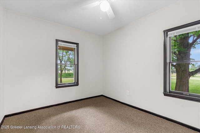 9840 W Herbison Rd, Eagle, MI 48822 - carpeted empty room with baseboards and a ceiling fan