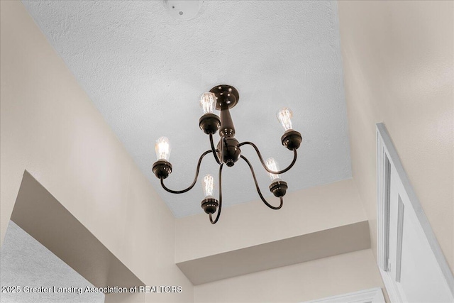 9840 W Herbison Rd, Eagle, MI 48822 - detailed view of a chandelier
