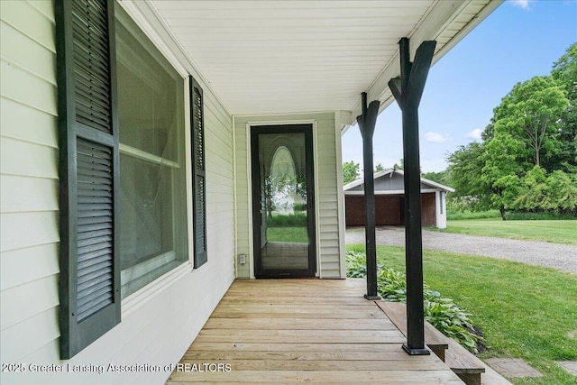 9840 W Herbison Rd, Eagle, MI 48822 - property entrance with a lawn and a porch