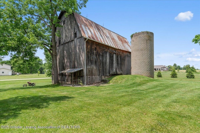 9840 W Herbison Rd, Eagle, MI 48822 - view of barn with a yard