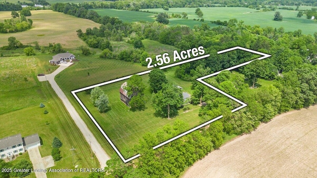 9840 W Herbison Rd, Eagle, MI 48822 - aerial view of sparsely populated area featuring property boundaries highlighted and a tree filled landscape