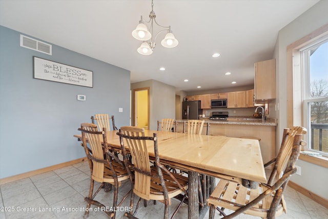 dining area with baseboards, visible vents, a chandelier, and recessed lighting