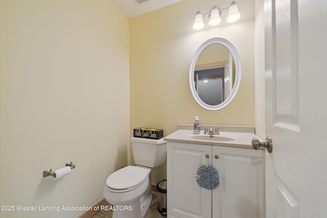 bathroom featuring visible vents, vanity, and toilet