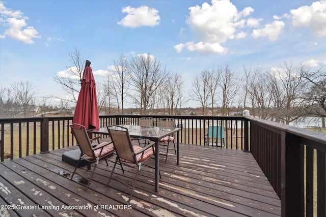 wooden deck featuring outdoor dining space