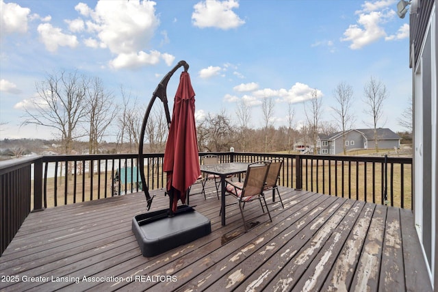 wooden deck featuring outdoor dining area