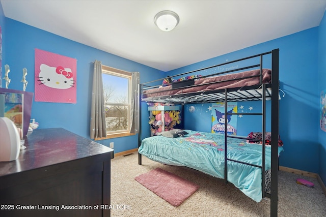 carpeted bedroom featuring baseboards