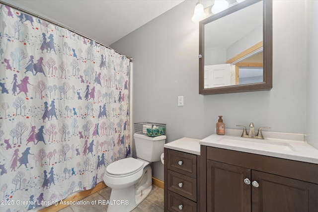 bathroom with tile patterned flooring, a shower with curtain, vanity, and toilet