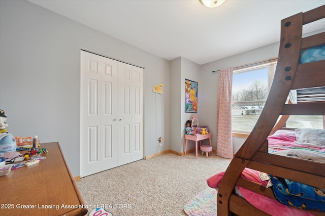 bedroom with a closet and baseboards