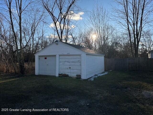 detached garage with fence