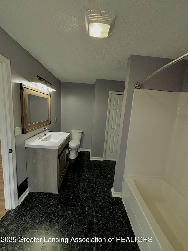 full bathroom with shower / bath combination, toilet, a textured ceiling, vanity, and baseboards