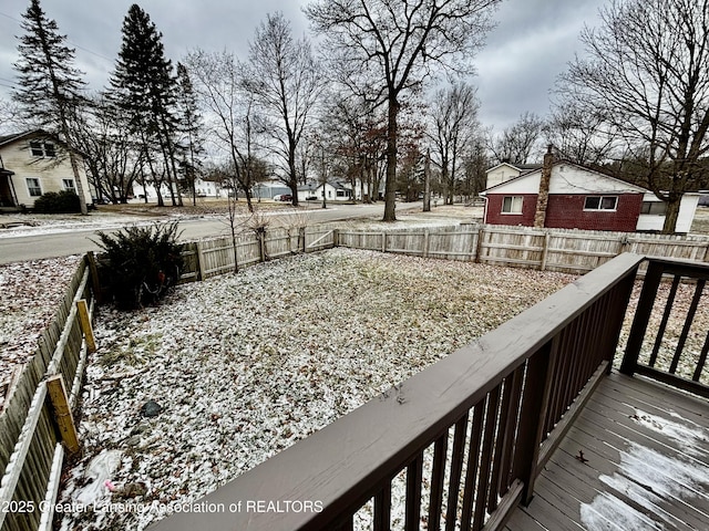 wooden deck featuring a fenced backyard and a residential view