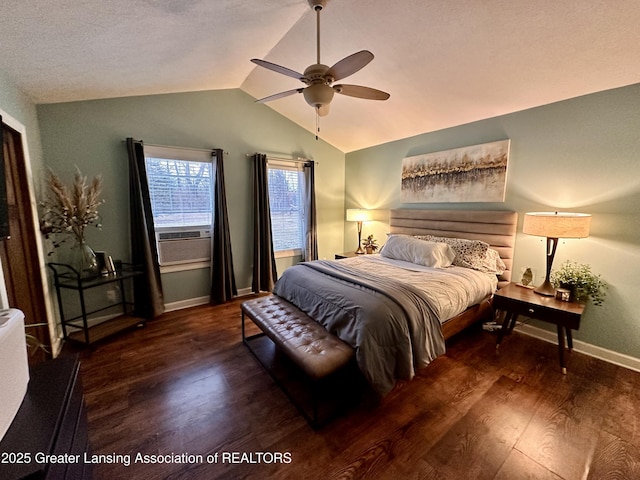 bedroom featuring baseboards, a ceiling fan, wood finished floors, vaulted ceiling, and cooling unit