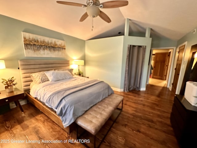 bedroom featuring ceiling fan, baseboards, vaulted ceiling, and wood finished floors