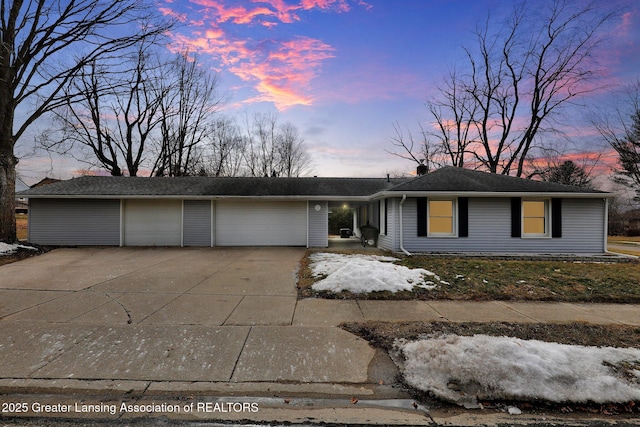 single story home featuring driveway, a garage, and a chimney