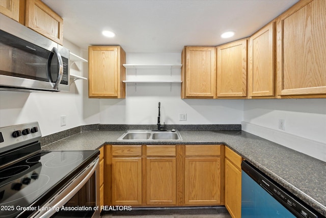 kitchen featuring dark countertops, stainless steel appliances, open shelves, a sink, and recessed lighting