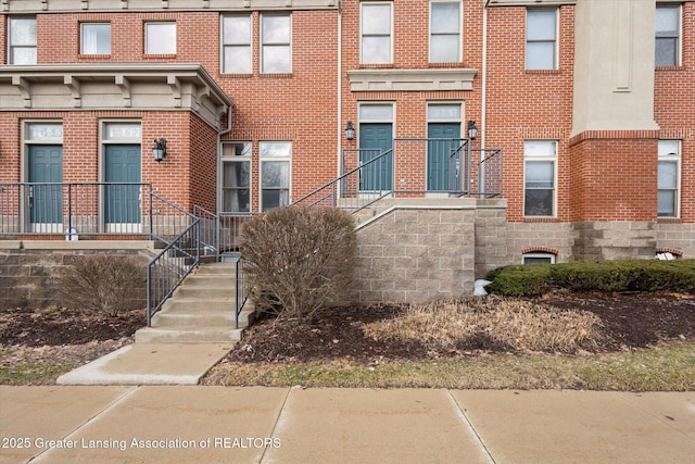 view of front of house featuring brick siding