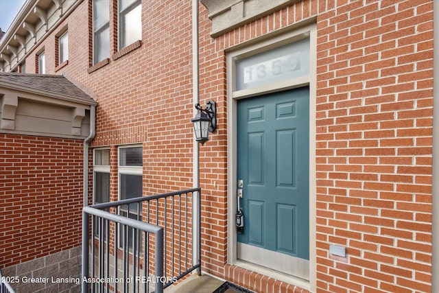 entrance to property with brick siding