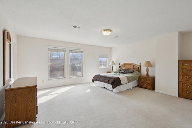 carpeted bedroom with visible vents